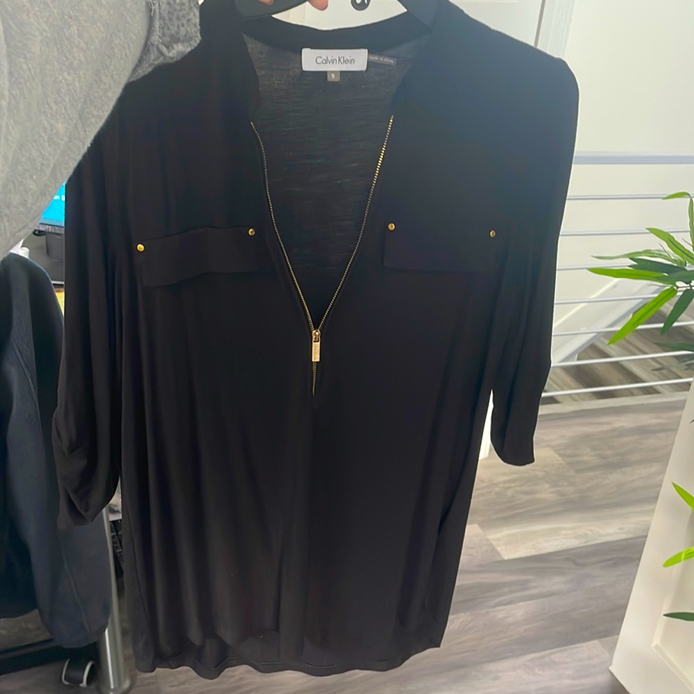 Calvin Klein Black Small dress shirt. Gold zip up and accents. Gently used